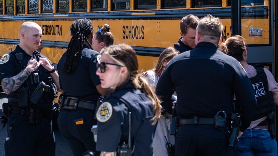 NASHVILLE, TN - MARCH 27: School buses with children arrive at Woodmont Baptist Church to be reunited with their families after a mass shooting at The Covenant School on March 27, 2023 in Nashville, Tennessee. According to initial reports, three students and three adults were killed by the shooter, a 28-year-old woman. The shooter was killed by police responding to the scene.