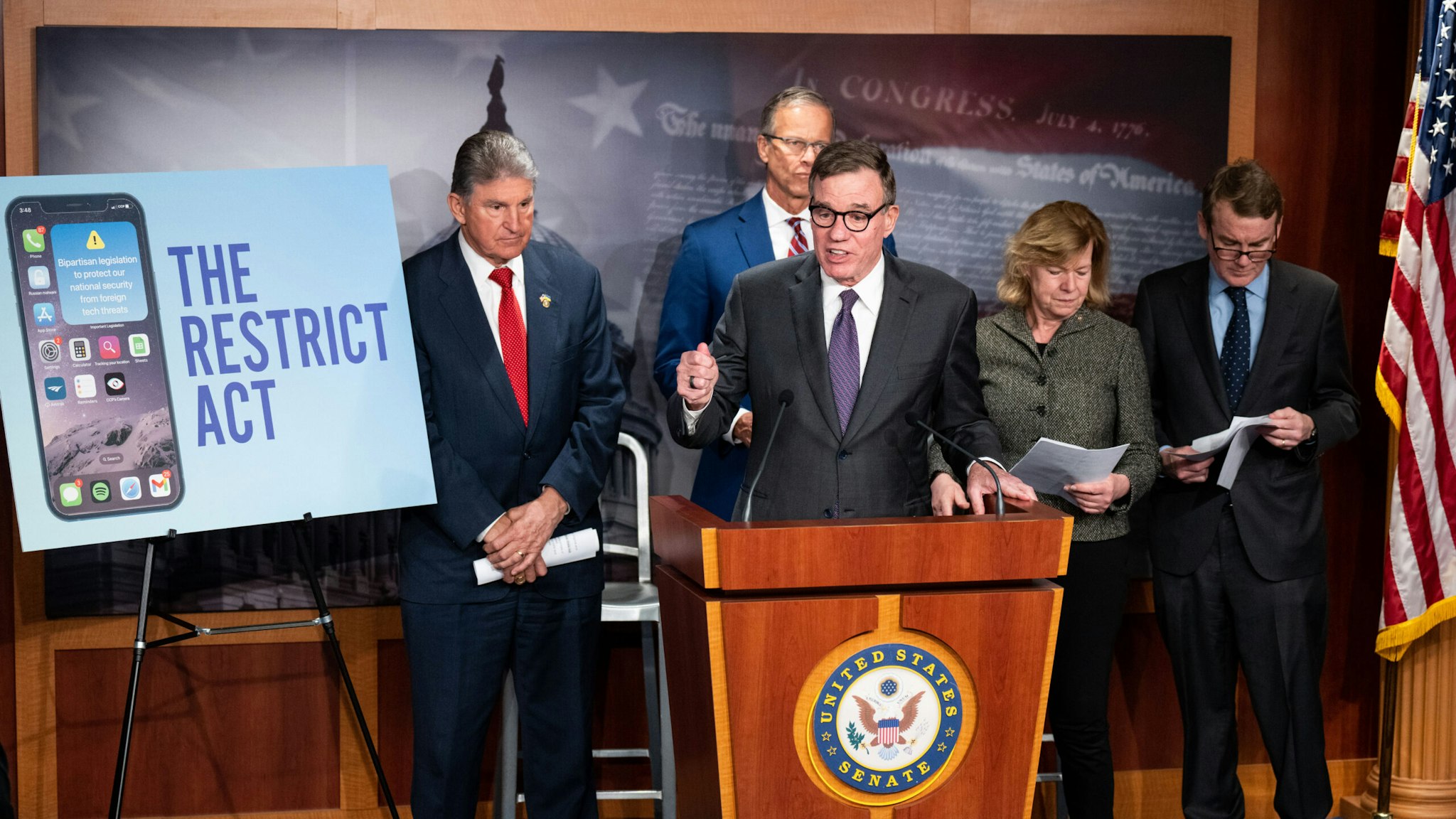 WASHINGTON - MARCH 7: Sen. Mark Warner, D-Va., speaks during the news conference to introduce the Restricting the Emergence of Security Threats that Risk Information Communications Technology Act, or RESTRICT Act, in the Capitol on Tuesday, March 7, 2023. . Warner is flanked from left by Sen. Joe Manchin, D-W. Va., Sen. John Thune, R-S. Dak., Sen. Tammy Baldwin, D-Wisc., and Sen. Michael Bennet, D-Colo.