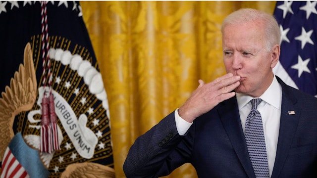 WASHINGTON, DC - JUNE 17: U.S. President Joe Biden blows a kiss to the audience before signing the Juneteenth National Independence Day Act into law in the East Room of the White House on June 17, 2021 in Washington, DC.