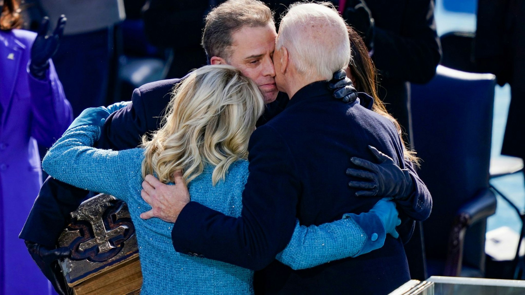 WASHINGTON, DC - JANUARY 20: U.S. President Joe Biden embraces his family First Lady Dr. Jill Biden, son Hunter Biden and daughter Ashley after being sworn in during his inauguation on the West Front of the U.S. Capitol on January 20, 2021 in Washington, DC. During today's inauguration ceremony Joe Biden becomes the 46th president of the United States.