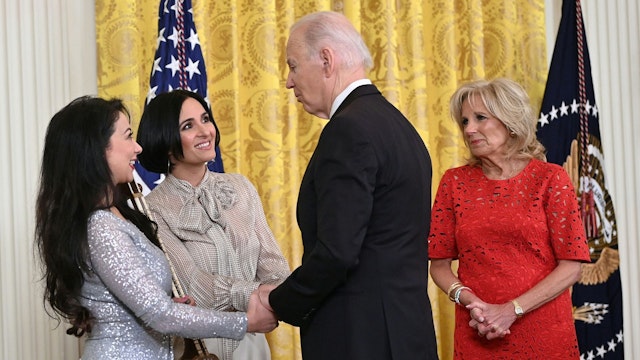 US President Joe Biden and US First Lady Jill Biden greet Musician Sahba Motallebi and Iranian-US singer-songwriter Rana Mansour during a Nowruz reception in the East Room of the White House in Washington, DC, on March 20, 2023. - Nowruz, meaning "New Day", celebrates the Persian New Year and the beginning of Spring.