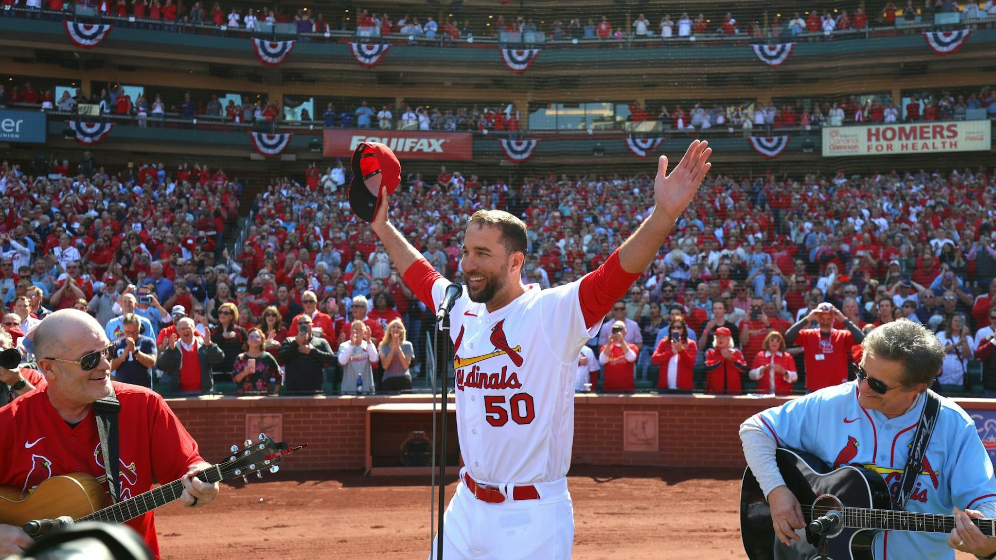 (ST. LOUIS, MO - MARCH 30: Adam Wainwright #50 of the St. Louis Cardinals sings the national anthem prior to the game between the Toronto Blue Jays and the St. Louis Cardinals at Busch Stadium on Thursday, March 30, 2023 in St. Louis, Missouri.