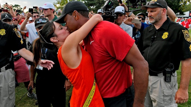 ATLANTA, GA - SEPTEMBER 23: Tiger Woods and his girlfriend Erica Herman celebrate after the final round of the TOUR Championship at East Lake Golf Club on September 23, 2018, in Atlanta, Georgia. (Photo by
