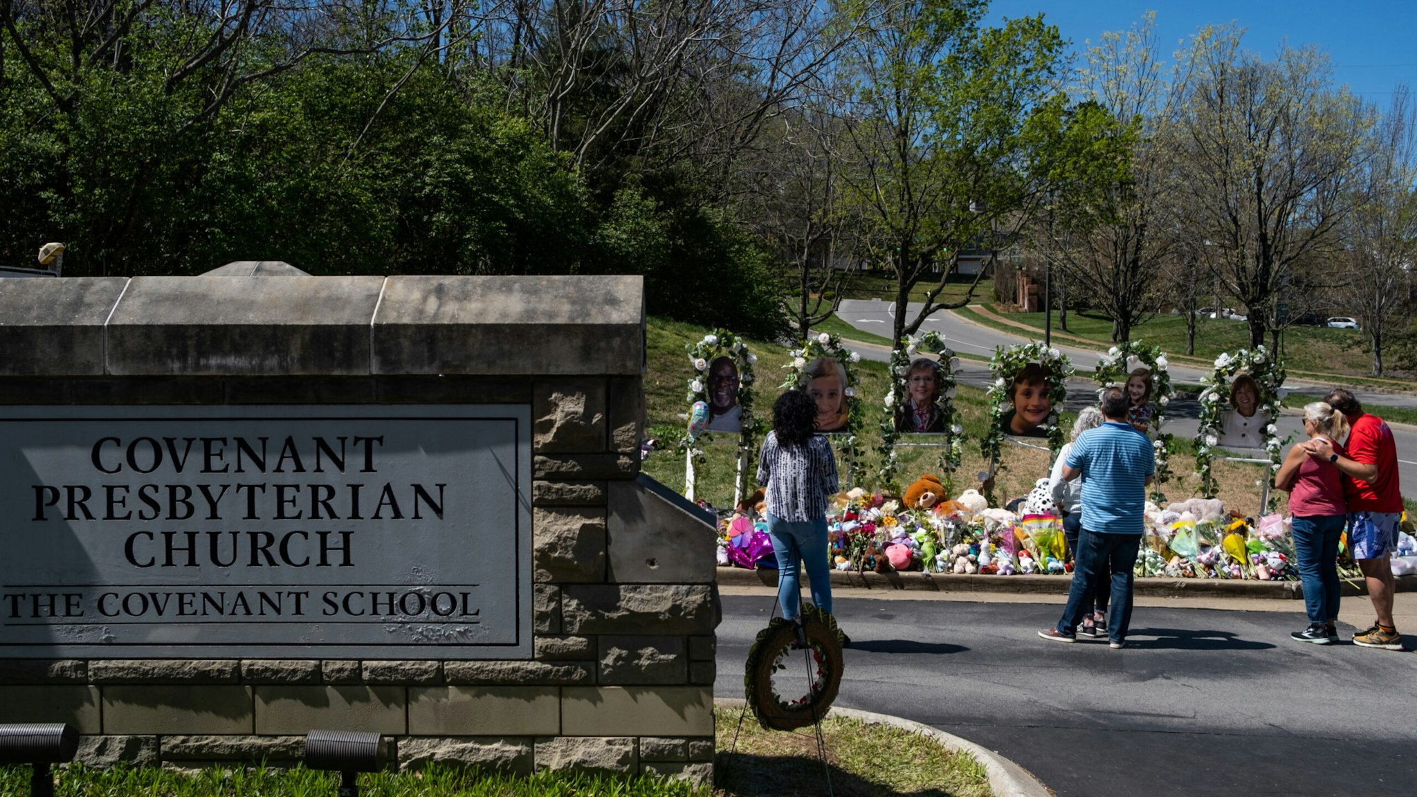People visit a makeshift memorial at the entrance of The Covenant School on April 1, 2023 in Nashville, Tennessee.