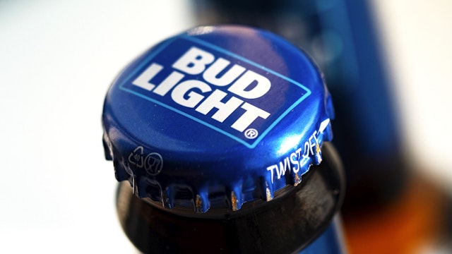 UKRAINE - 2021/08/27: In this photo illustration, the Bud Light beer bottle seen displayed in a store. This beer is produced by Anheuser-Busch, ink.