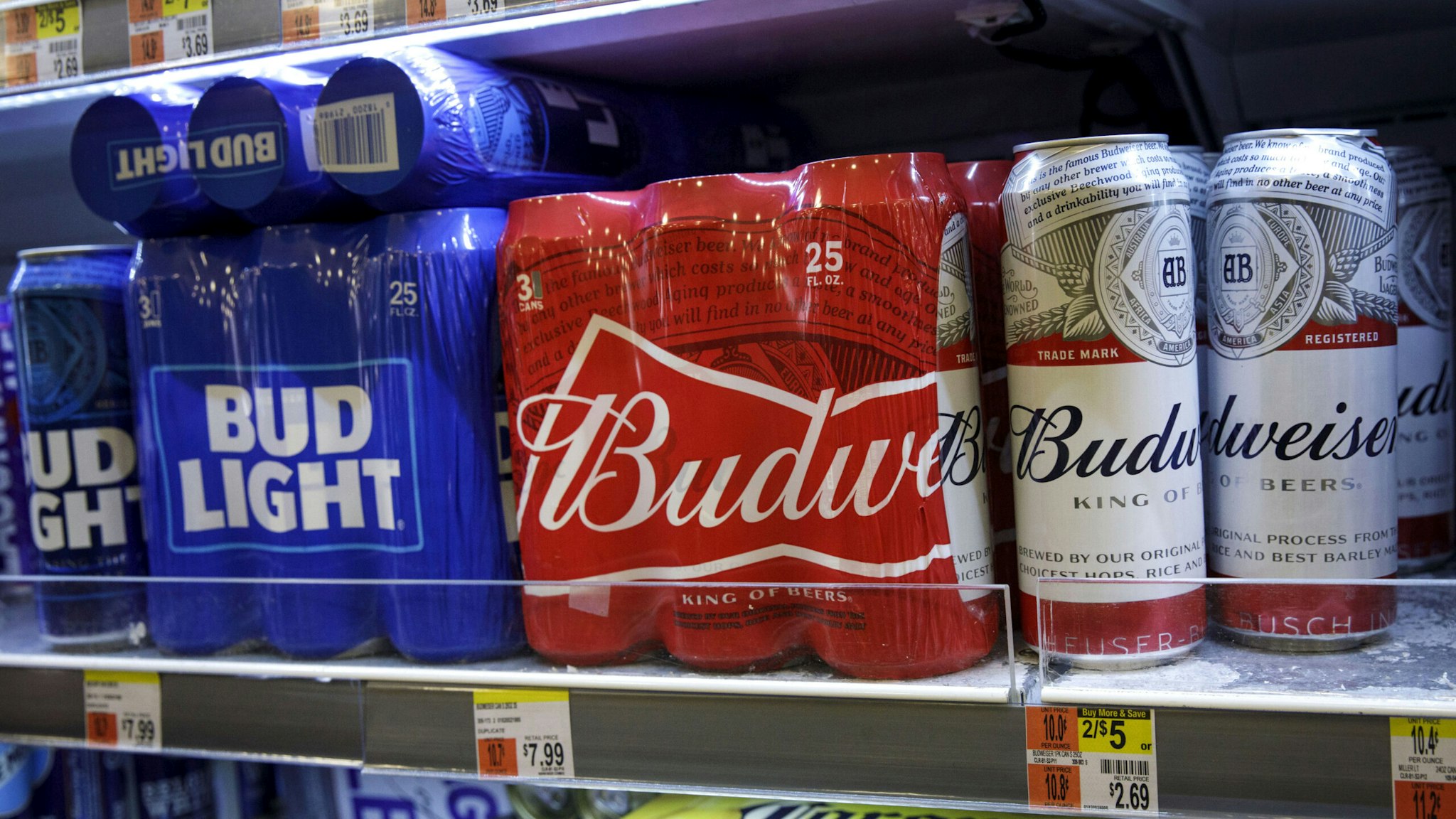 ORK, NY - JULY 26: Cans of Budweiser and Bud Light sit on a shelf for sale at a convenience store, July 26, 2018 in New York City. Anheuser-Busch InBev, the brewer behind Budweiser and Bud Light, said on Thursday that U.S. revenues fell 3.1% in the second quarter. American consumers continue to shift away from domestic lagers and toward crafts beers and wine and spirits.