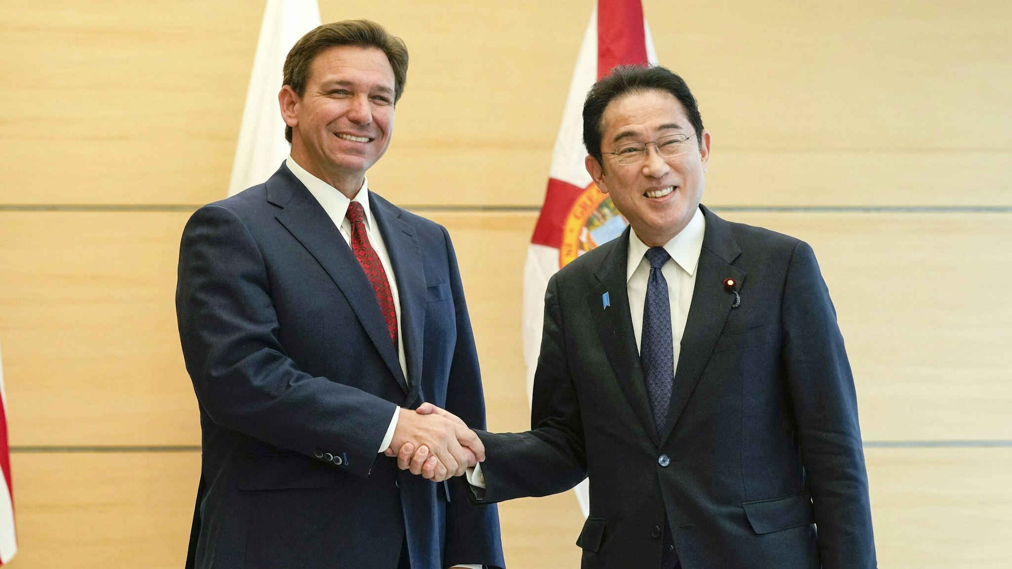 Florida Governor Ron DeSantis (L) shakes hands with Japanese Prime Minister Fumio Kishida as he pays a courtesy call at the latter's official residence in Tokyo April 24, 2023.