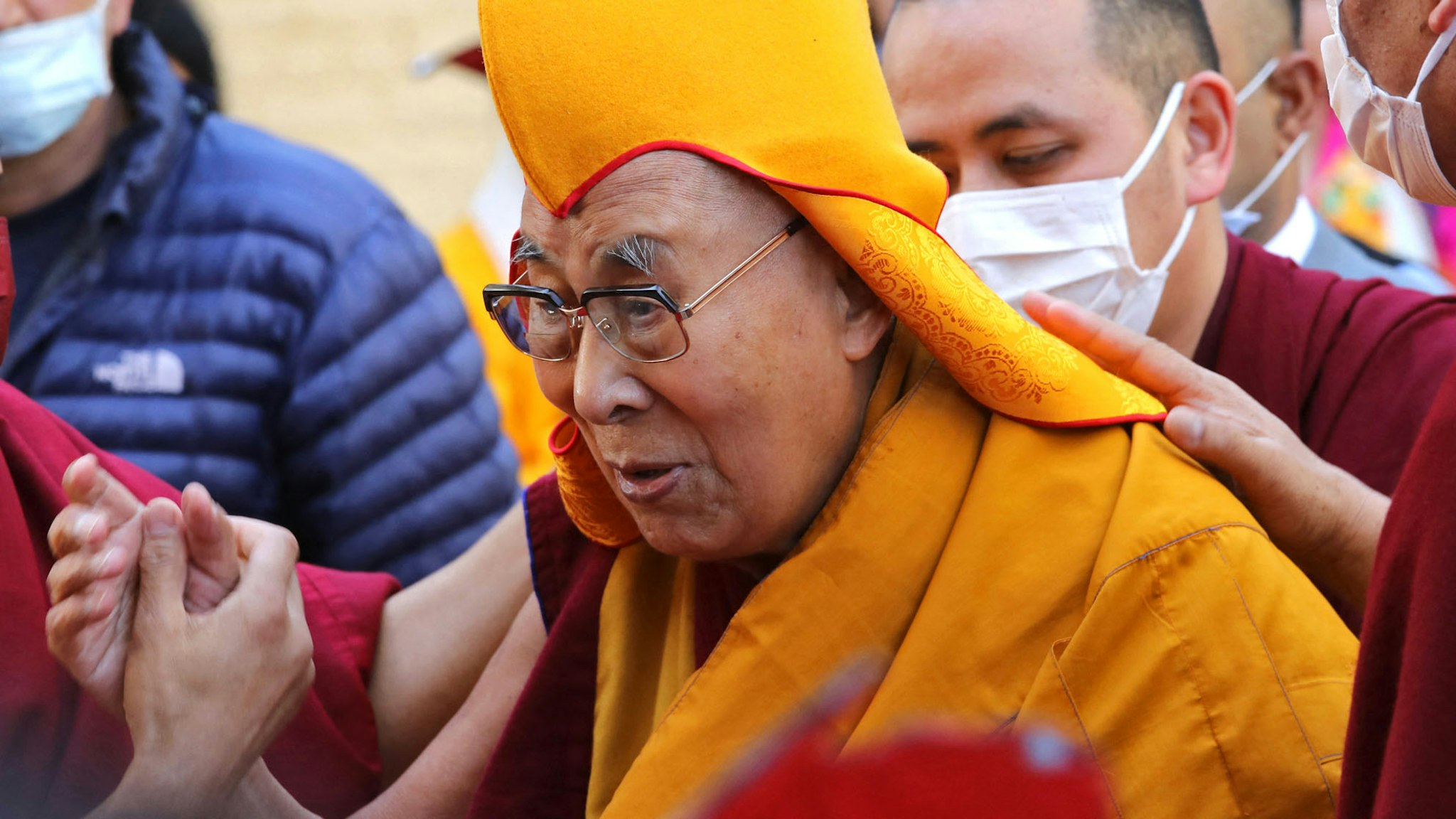 Tibetan spiritual leader Dalai Lama (C) arrives to attend a prayer at the Main Tibetan Temple in McLeod Ganj on April 5, 2023.