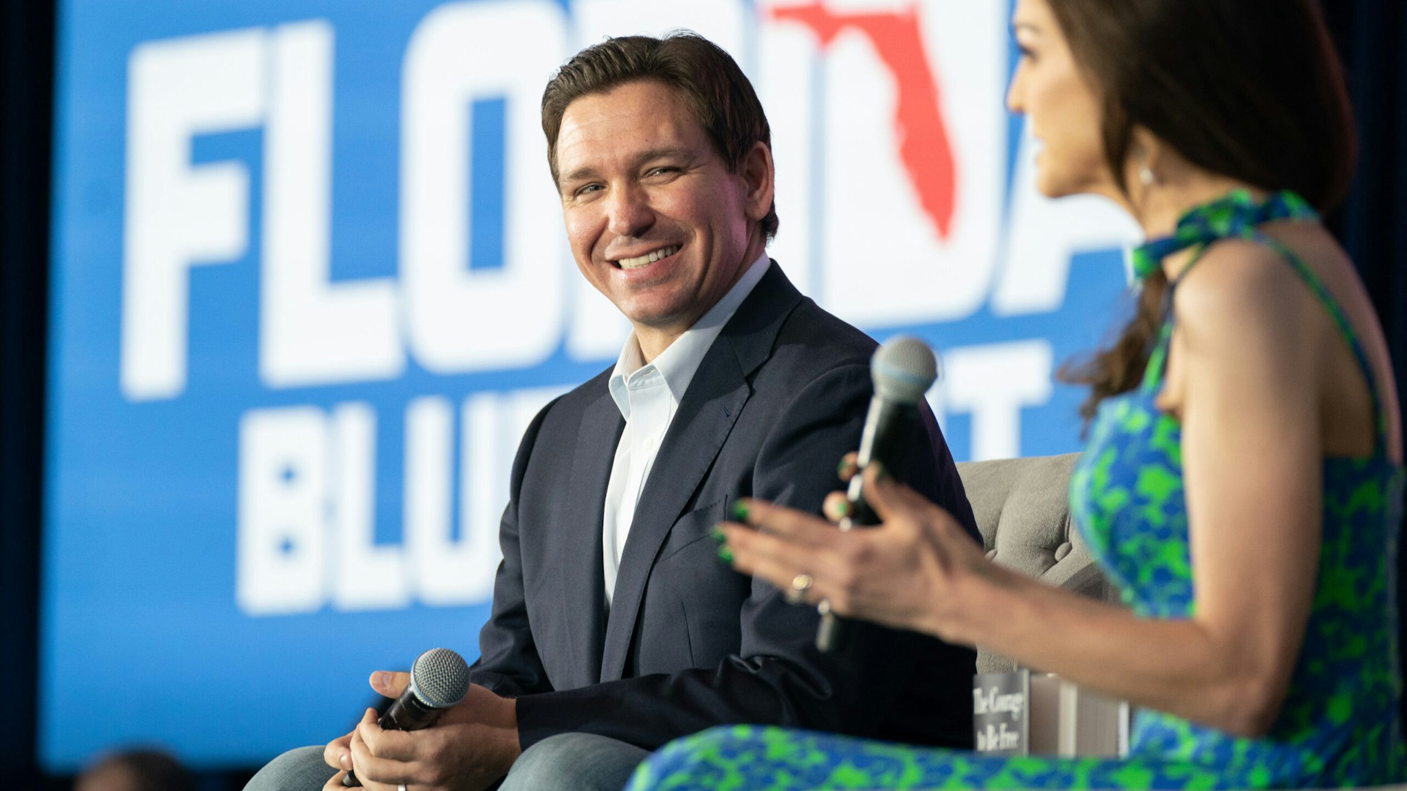 NORTH CHARLESTON, SC - APRIL 19: Florida Governor Ron DeSantis, left, and his wife, Casey DeSantis, speak to a crowd at the North Charleston Coliseum on April 19, 2023 in North Charleston, South Carolina. The Governor's appearance marks his first official visit to the "First in the South" presidential primary state amid mounting anticipation of his 2024 presidential candidacy.