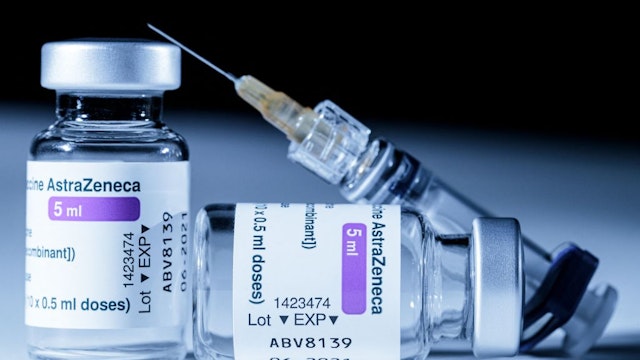 This picture shows vials of the AstraZeneca Covid-19 vaccine and a syringe in Paris on March 11, 2021. - European countries can keep using AstraZeneca's coronavirus vaccine during an investigation into cases of blood clots that prompted Denmark, Norway and Iceland to suspend jabs, the EU's drug regulator said on March 11, 2021. (Photo by JOEL SAGET / AFP) (Photo by JOEL SAGET/AFP via Getty Images)