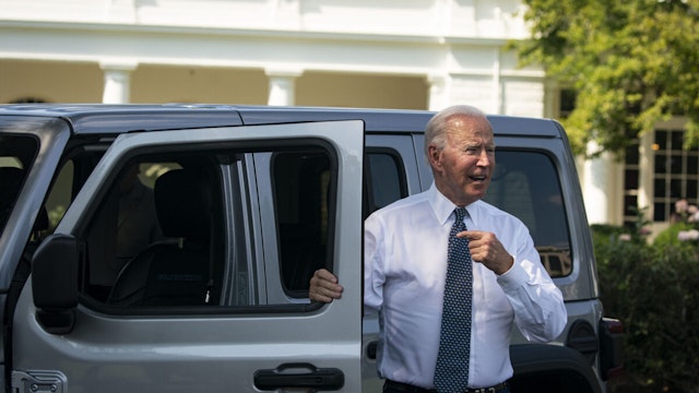 U.S. President Joe Biden speaks to members of the media after driving a Jeep Wrangler Rubicon electric vehicle during an event on the South Lawn of the White House in Washington, D.C., U.S., on Thursday, Aug. 5, 2021. Biden has called for half of all vehicles sold in the U.S. to be capable of emissions-free driving by the end of the decade, an ambitious goal that automakers say can only be achieved with bigger government investment in charging stations and other infrastructure.