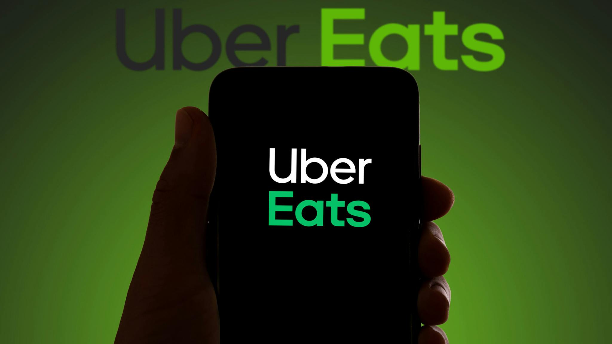 In this photo illustration the logo of the food delivery