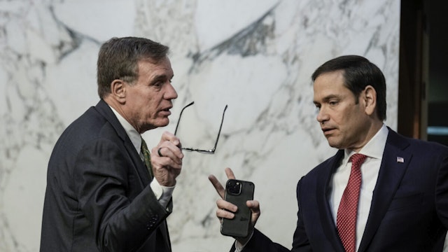 Committee chairman Sen. Mark Warner (D-VA) talks with ranking member Sen. Marco Rubio (R-FL) during a Senate Intelligence Committee hearing concerning worldwide threats, on Capitol Hill March 8, 2023 in Washington, DC.