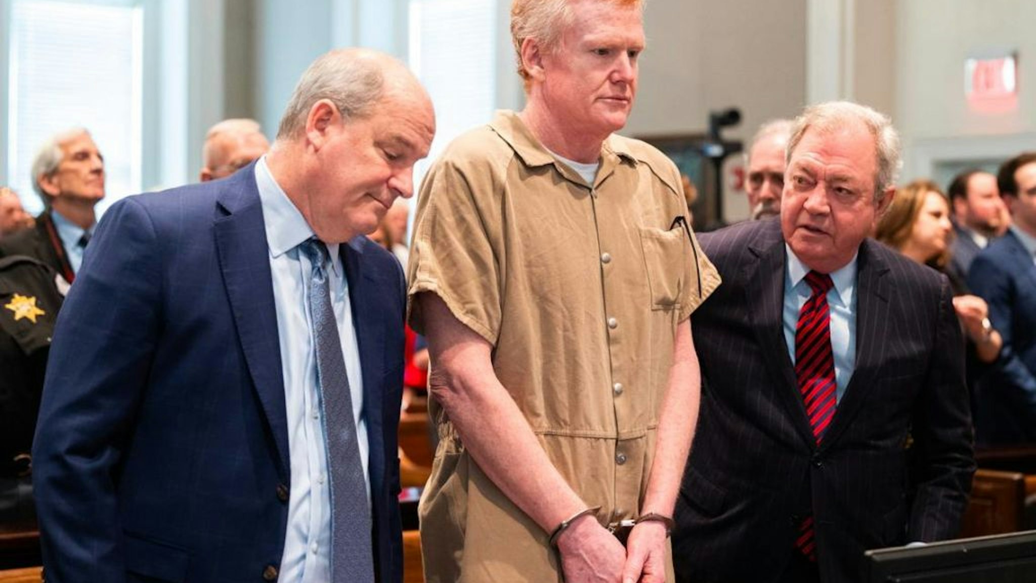 Alex Murdaugh, center, speaks with his legal team before he is sentenced to two consecutive life sentences for the murder of his wife and son at the Colleton County Courthouse in South Carolina on March 3, 2023.