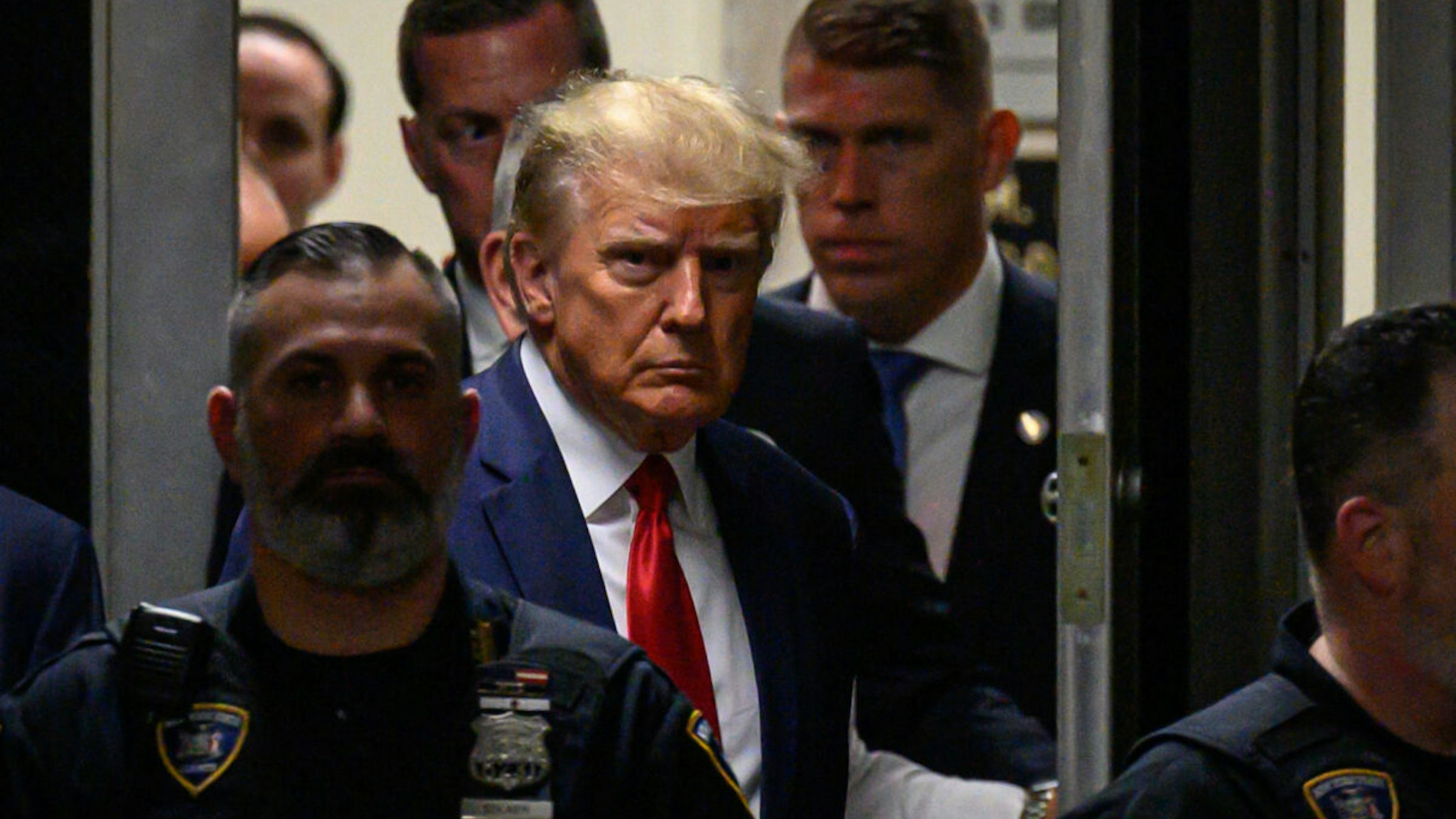 Former US President Donald Trump makes his way inside the Manhattan Criminal Courthouse in New York on April 4, 2023.