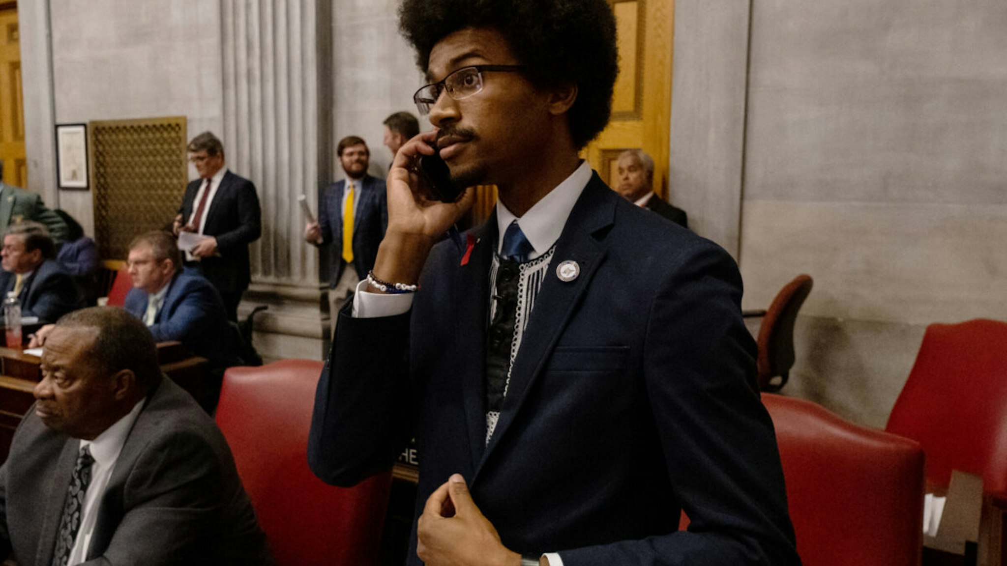 NASHVILLE, TN - APRIL 06: Democratic state Rep. Justin Pearson of Memphis speaks on his phone while being expelled from the state Legislature on April 6, 2023 in Nashville, Tennessee. Pearson and fellow Democratic Reps. Gloria Johnson of Knoxville and Justin Jones of Nashville were brought up for expulsion for leading chants of protesters from the floor in the wake of a mass shooting at a Christian school in which three 9-year-old students and three adults were killed by a 28-year-old former student of the school on March 27. Pearson and Jones, who is also Black, were expelled while the vote against Johnson, who is white, fell one vote short.
