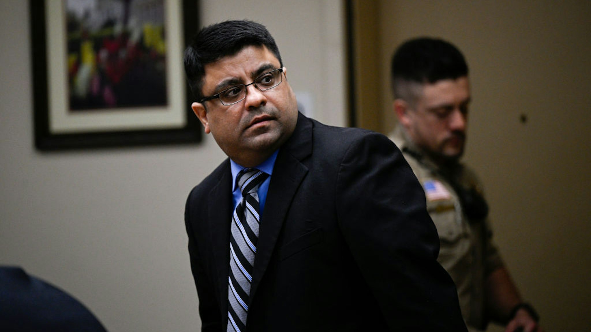 Riverside, CA - April 18: Anurag Chandra, a Temescal Valley resident looks back toward members of the public as his trial begins Tuesday, April 18, 2023, in Riverside. Prosecutors say on Jan. 23, 2020, he allegedly killed three Corona teenagers by running them off the road after they played a doorbell-ringing prank on the man.