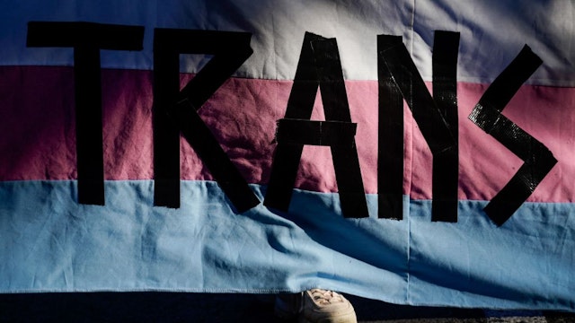 MADRID, SPAIN - JUNE 28: A girl holds a banner at a rally focused on transgender people on June 28, 2021, in Madrid, Spain. Organized by Orgullo Critico, the march aims to show support for the trans community to coincide with International LGTBI Pride Day. Under the slogan 'Neither assigned sex, nor demonstrated gender. Trans rage against all authority', the group wants to remember that they have been fighting for 15 years against "heteronormality disguised as inclusion" in society. (Photo By A. Perez Meca/Europa Press via Getty Images)