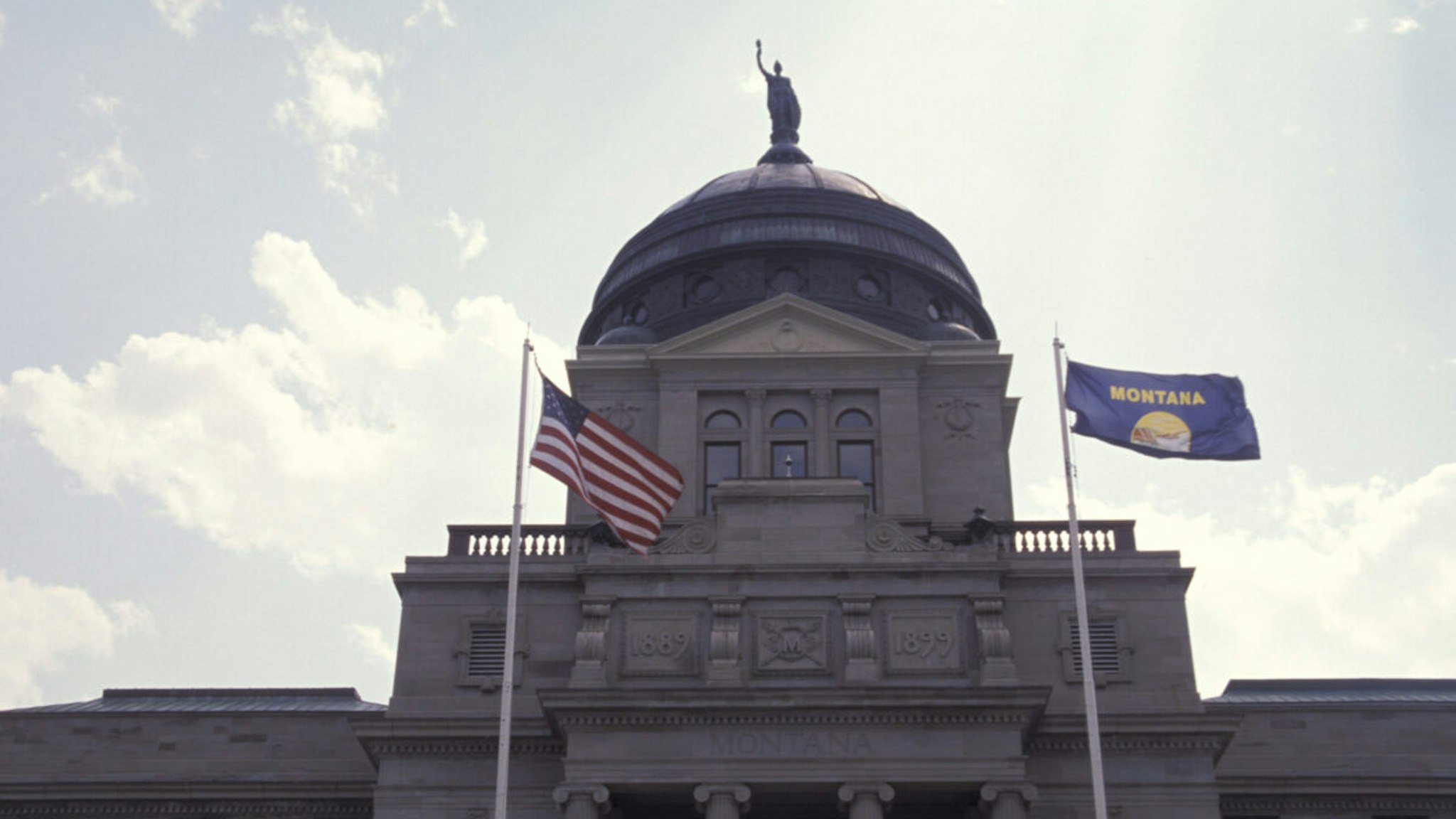 Montana, Helena, State Capitol Building, United States And Montana Flags.