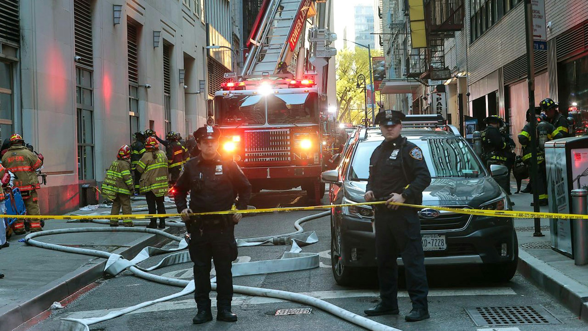 NEW YORK, UNITED STATES - APRIL 18: Police take security measures around the partially collapsed parking garage in Manhattan, New York, United States on April 18, 2023. A parking garage partially collapsed in New York City on Tuesday, leaving at least one person dead and several others injured.