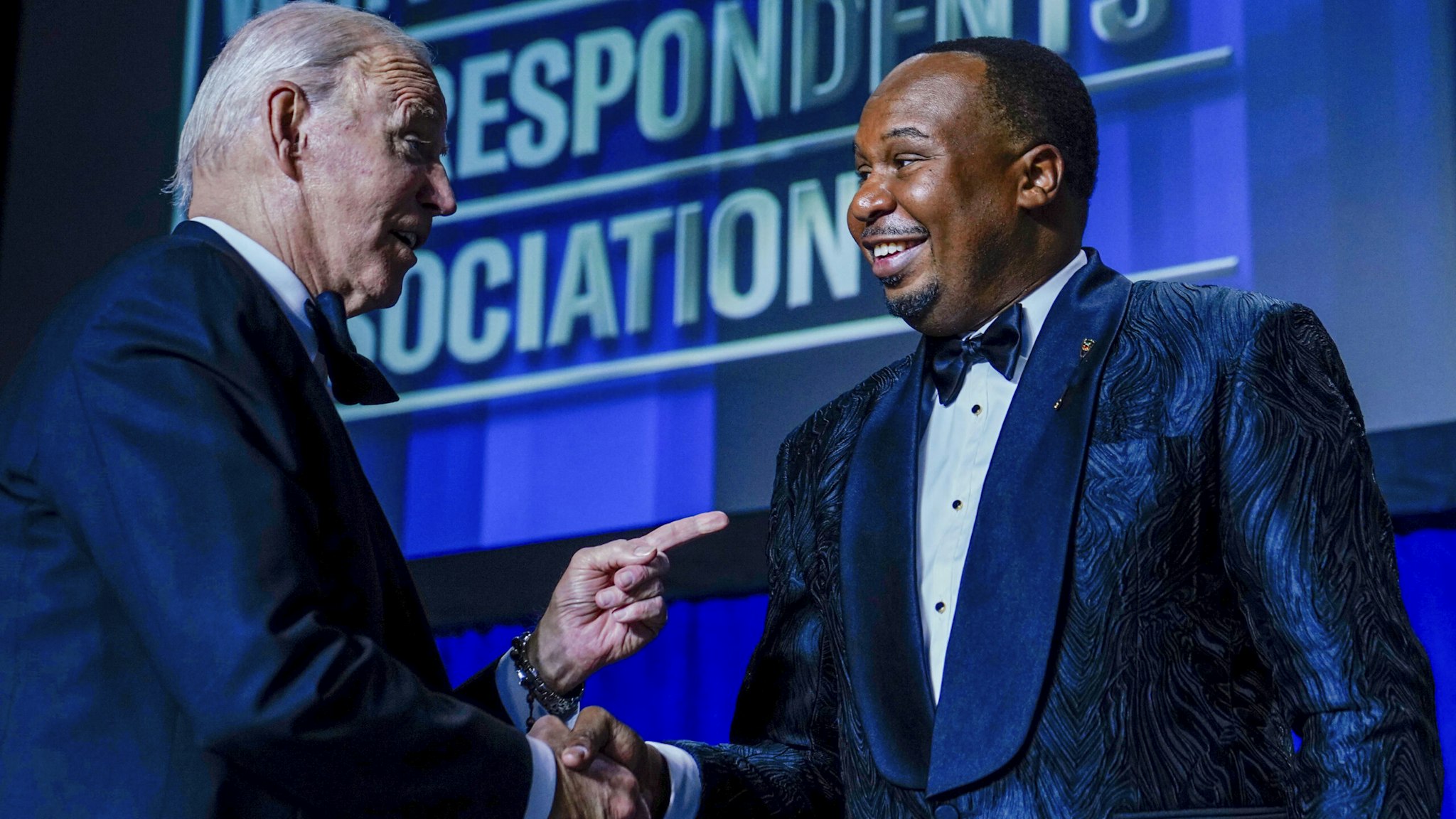 US President Joe Biden, left, shakes hands with comedian Roy Wood Jr. during the White House Correspondents' Association (WHCA) dinner in Washington, DC, US, on Saturday, April 29, 2023. The annual dinner raises money for WHCA scholarships and honors the recipients of the organization's journalism awards.