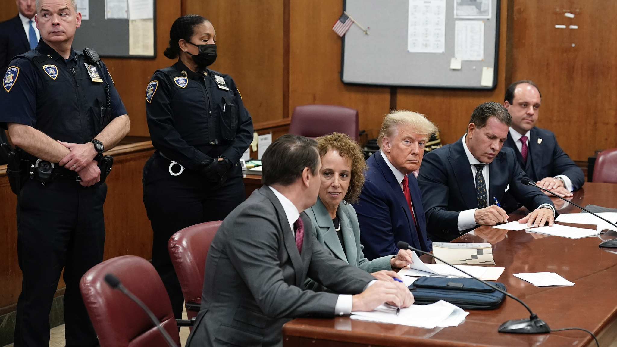 NEW YORK, NEW YORK - APRIL 04: Former U.S. President Donald Trump sits at the defense table with his defense team in a Manhattan court during his arraignment on April 4, 2023, in New York City. Trump was arraigned during his first court appearance today following an indictment by a grand jury that heard evidence about money paid to adult film star Stormy Daniels before the 16 presidential election. With the indictment, Trump becomes the first former U.S. president in history to be charged with a criminal offense.