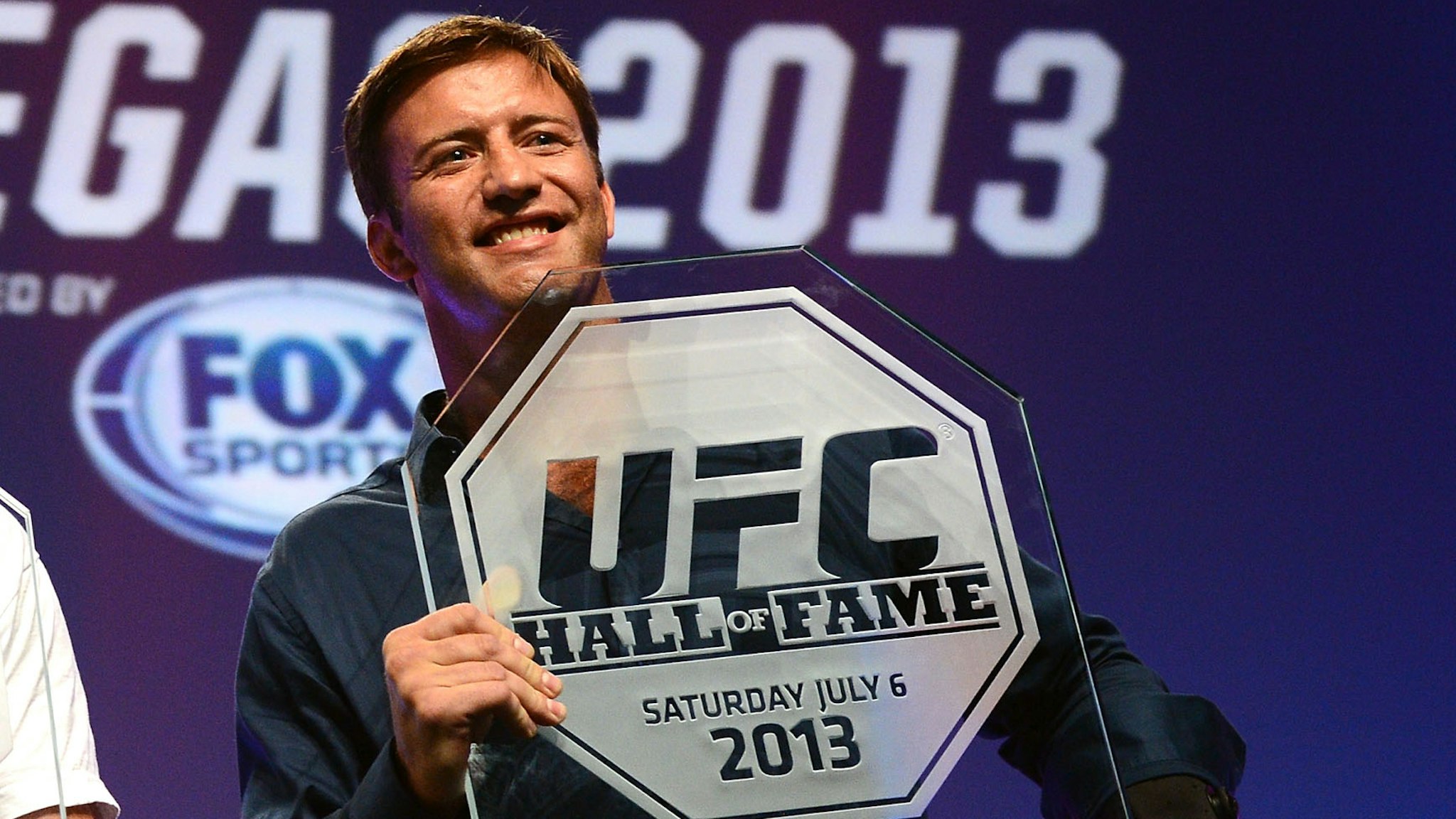 LAS VEGAS, NV - JULY 06: (L-R) Forrest Griffin and Stephan Bonnar pose for photos with their UFC Hall of Fame plaques during the UFC Fan Expo Las Vegas 2013 at the Mandalay Bay Convention Center on July 6, 2013 in Las Vegas, Nevada.