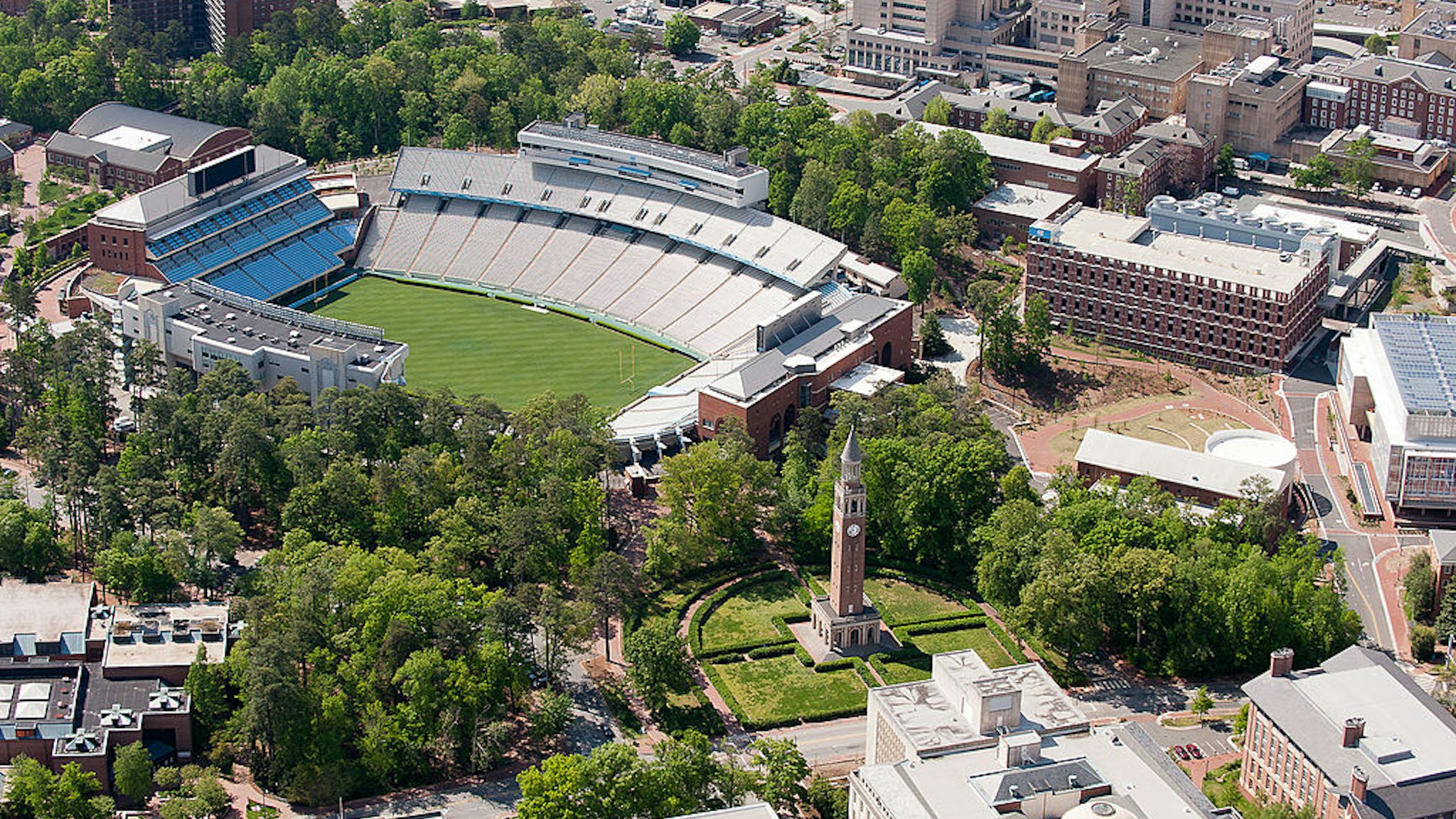 CHAPEL HILL, NC - APRIL 21: An aerial view of the University of North Carolina campus including Kenan Stadium (left) and the Morehead-Patterson Bell Tower (center) on April 21, 2013 in Chapel Hill, North Carolina. (Photo by Lance King/Getty Images)