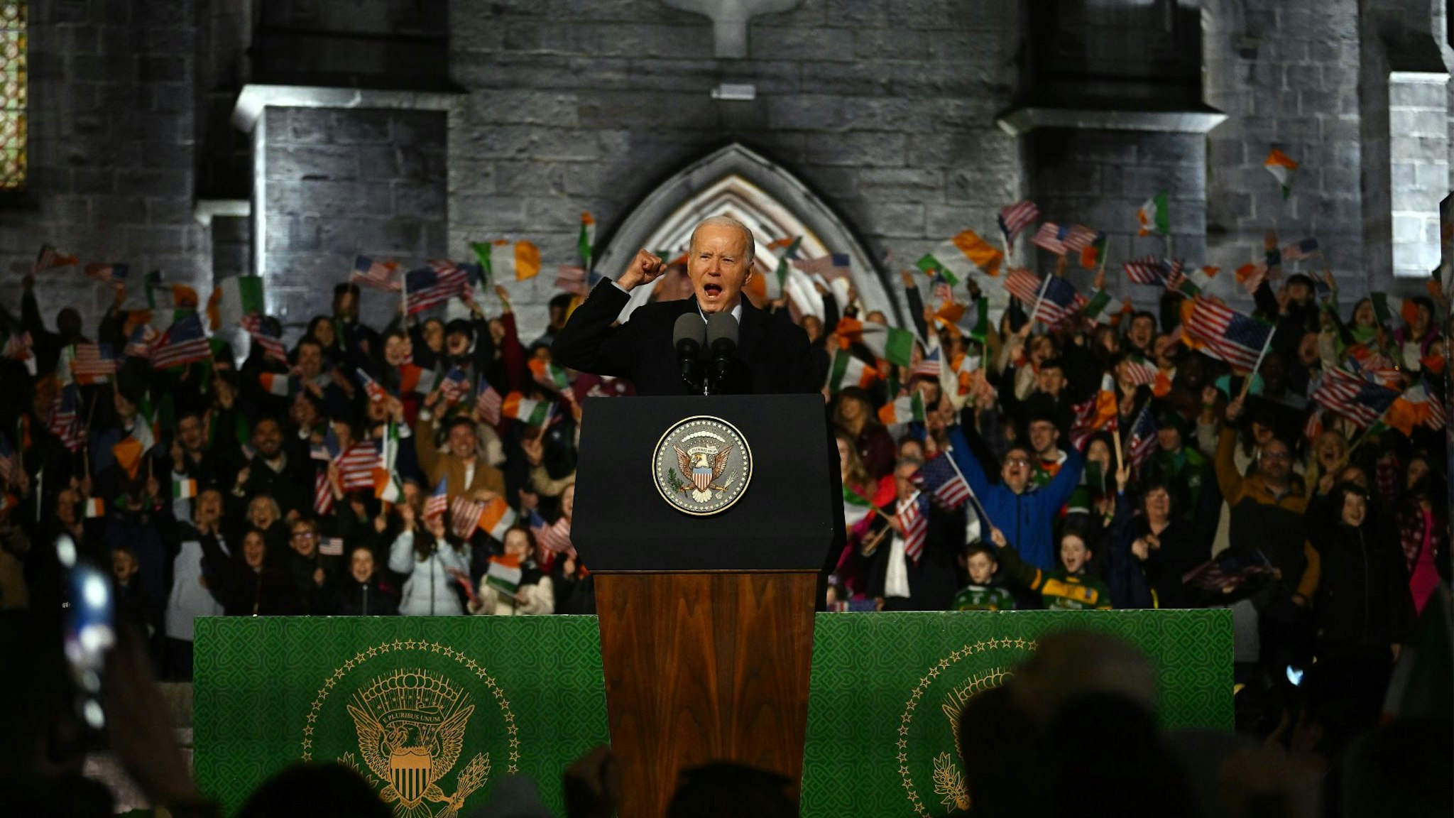 BALLINA, IRELAND - APRIL 14: U.S. President Joe Biden addresses a crowd during a celebration event at St Muredach's Cathedral on April 14, 2023 in Ballina, Ireland. U.S. President Joe Biden has travelled to Northern Ireland and Ireland with his sister Valerie Biden Owens and son Hunter Biden to explore his family's Irish heritage and mark the 25th Anniversary of the Good Friday Peace Agreement.