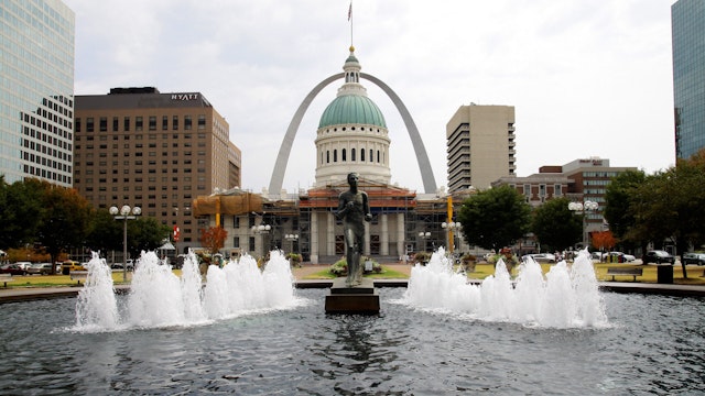 The Gateway Arch is the perfect backdrop for the Old Courthouse and "The Runner" fountain sculpture, in St. Louis, Missouri on AUGUST 04, 2012.