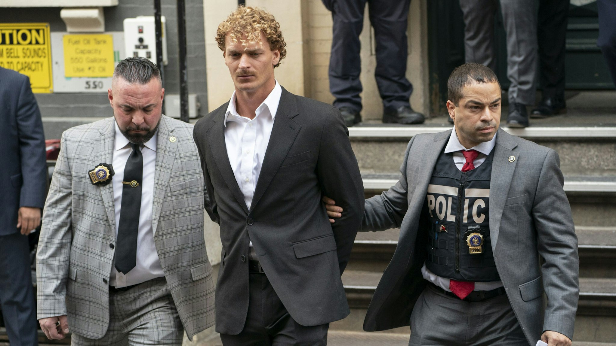 Daniel Penny is escorted from the NYPD 5th Precinct stationhouse in Manhattan on Friday, May 12, 2023.