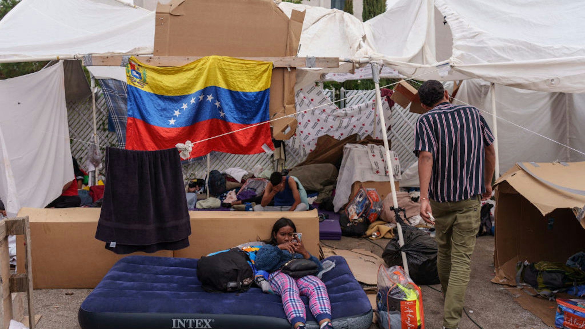 Migrants camped out in front of Opportunity Center for the Homeless before the lifting of Title 42 in El Paso, Texas, US, on Wednesday, May 3, 2023. Photographer: Paul Ratje/Bloomberg