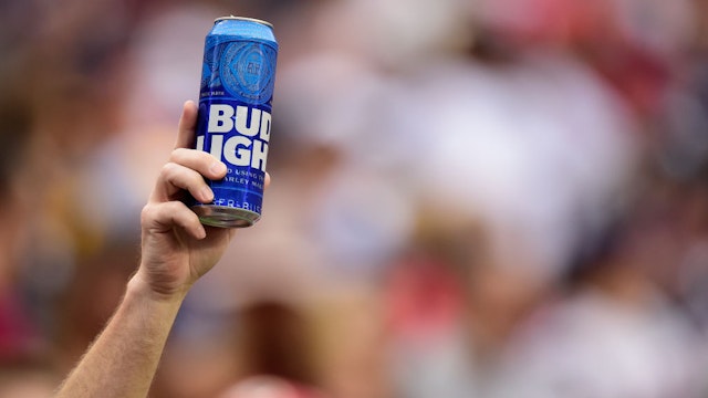 LANDOVER, MD - OCTOBER 06: A fan holds up a can of Bud Light during a game between the New England Patriots and Washington Redskins at FedExField on October 6, 2019 in Landover, Maryland. (Photo by