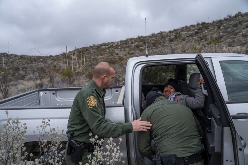 United States Border Patrol Agents Arain Carrera and Thaddeus Cleveland help an injured Guatemalan man into a vehicle on January 30, 2020 near Sanderson, Texas. - Left behind when he injured his knee after making it across the river, the man was stranded for three days in a desolate ravine in the San Rosendo Canyon of west Texas until Border Patrol agents found him. Operating in remote and inhospitable terrain miles from anywhere, the green-clad Border Patrol agents are on the frontlines of a wave of Central American migrants heading into the US that has prompted a crackdown by President Donald Trump. (Photo by Paul Ratje / AFP) (Photo by PAUL RATJE/AFP via Getty Images)