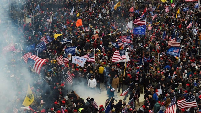 TOPSHOT - Trump supporters clash with police and security forces as they storm the US Capitol in Washington D.C on January 6, 2021. - Demonstrators breeched security and entered the Capitol as Congress debated the a 2020 presidential election Electoral Vote Certification.