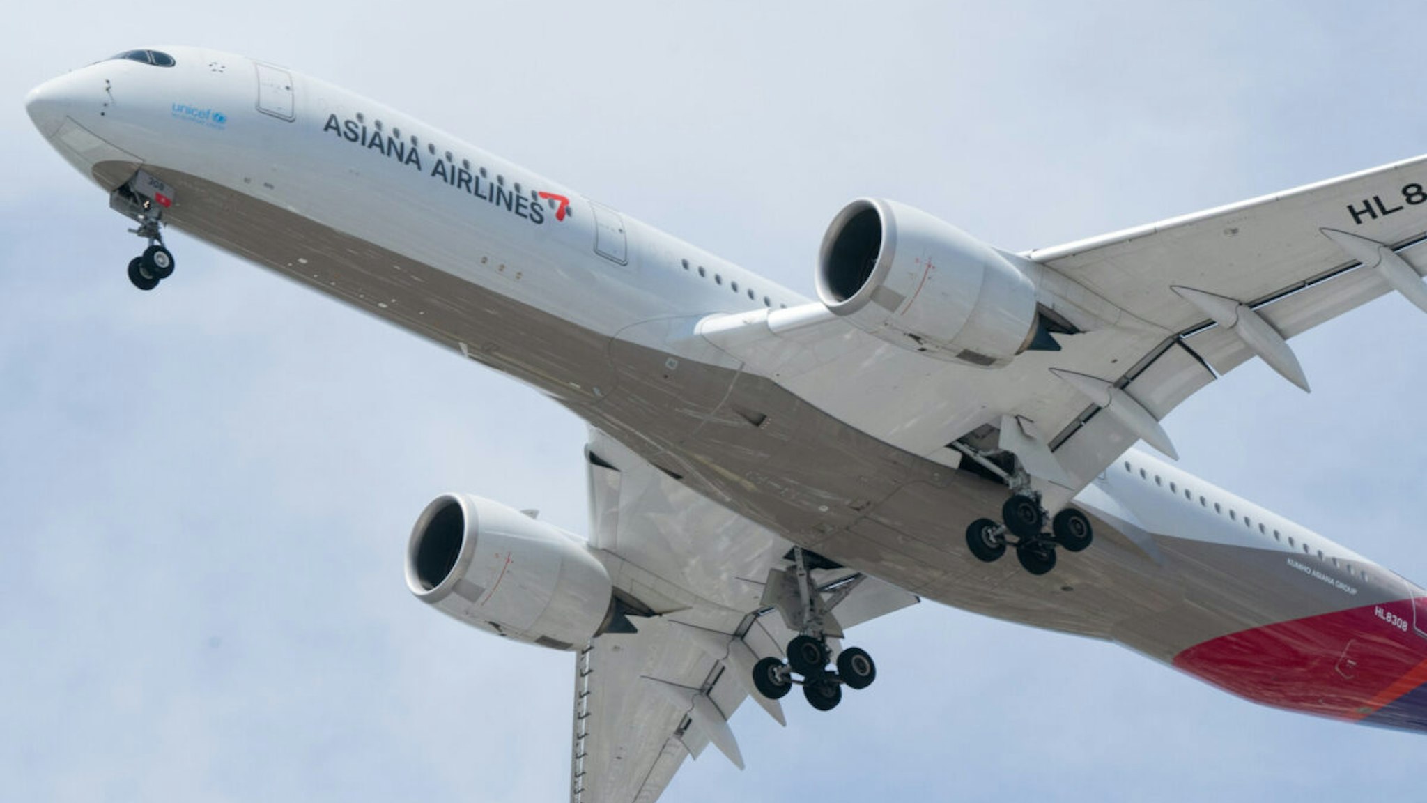 An Airbus A350-900 jetliner aircraft operated by Asiana Airlines Inc makes a descent into Los Angeles International Airport (LAX) in Los Angeles, California, U.S., on Friday, May 28, 2021. The days of bargain basement airfares are ending as the U.S. vaccine supply unleashes a wave of pent-up travel demand.