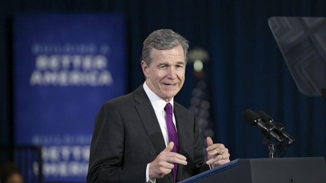 North Carolina Governor Roy Cooper speaks before President Joe Biden speaks to guests during a visit to North Carolina Agricultural and Technical State University on April 14, 2022 in Greensboro, North Carolina. Biden was in North Carolina to discuss his administration's