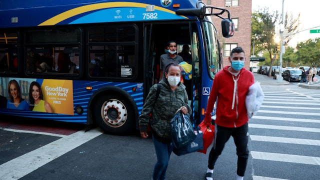 UNITED STATES - October 12: MANHATTAN, NY 10/12/2022 - Around 60 recently arrived migrants from Venezuela are seen being dropped off by an MTA Bus at a shelter at Bellevue early Wednesday morning.