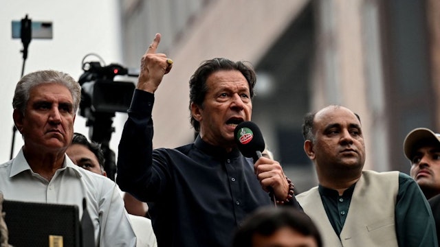 Pakistan's former prime minister Imran Khan (C) addresses his supporters during an anti-government march towards capital Islamabad, demanding early elections, in Gujranwala on November 1, 2022.