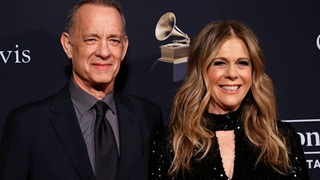 US actor Tom Hanks (L) and his wife US singer and actress Rita Wilson arrive for the Recording Academy and Clive Davis pre-Grammy gala at the Beverly Hilton hotel in Beverly Hills, California on February 4, 2023. (Photo by Michael TRAN / AFP) (Photo by MICHAEL TRAN/AFP via Getty Images)