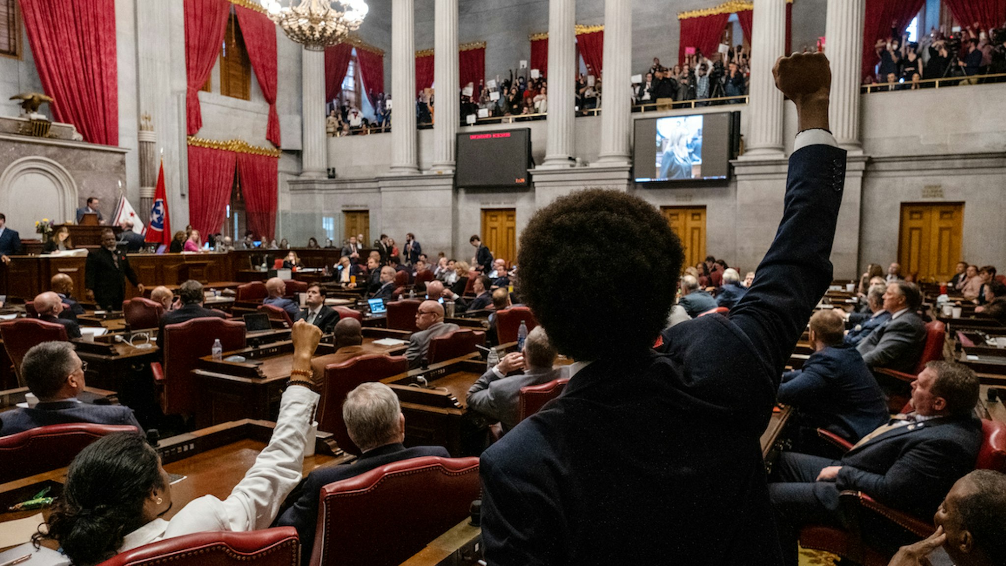 Democratic Rep. Justin Jones of Nashville, and Rep. Justin Pearson of Memphis, raise their fists to supporters in the House Gallery before being expelled on April 6, 2023 in Nashville, Tennessee. (Photo by Seth Herald/Getty Images)