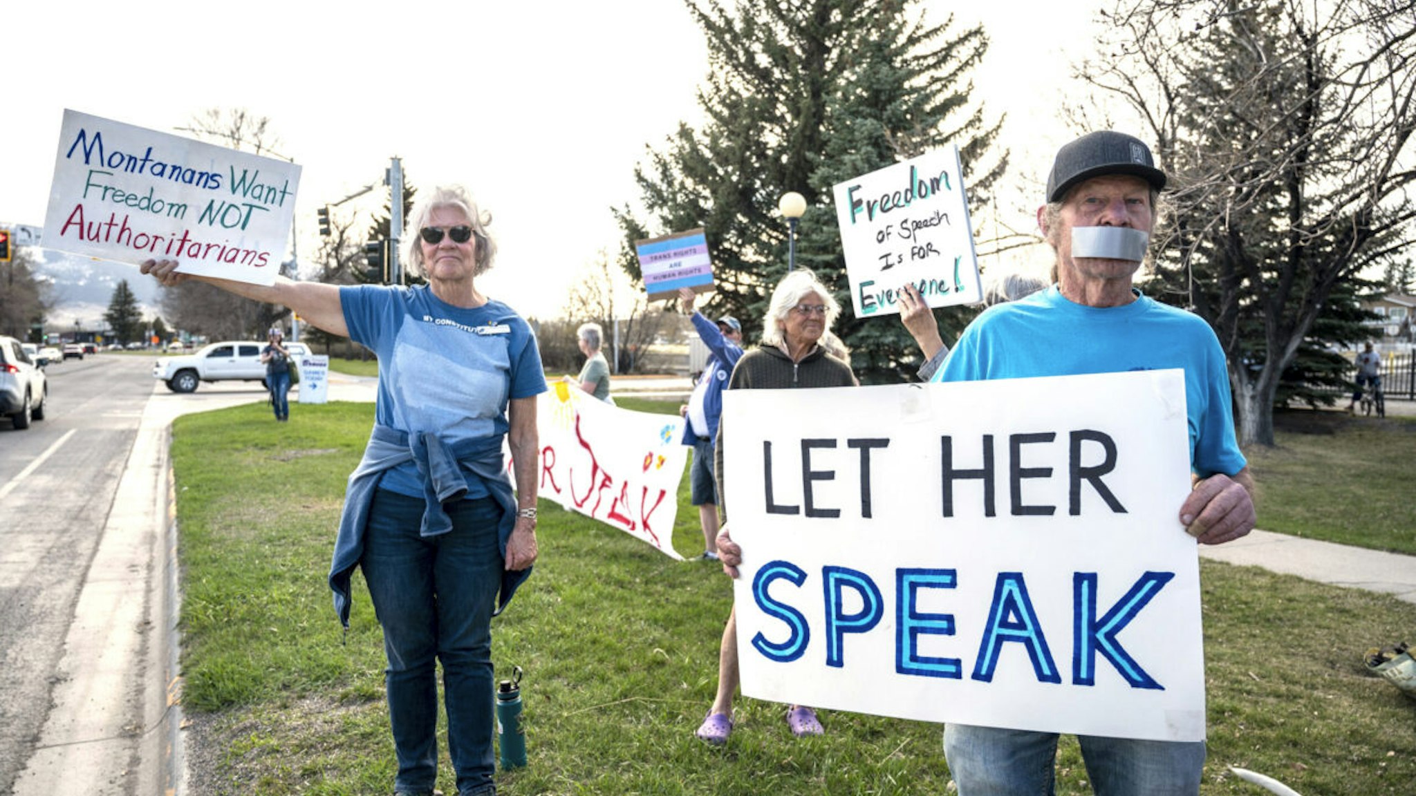 Supporters hold signs near a rally in support of transgender lawmaker Zooey Zephyr on April 29, 2023 in Livingston, Montana. Zephyr was banned from the floor of the Montana legislature after speaking out against an anti-transgender bill.