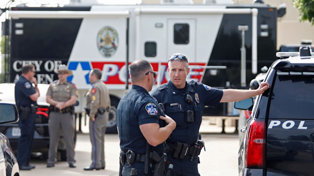 ALLEN, TEXAS - MAY 7: Law enforcement works the scene on the day after a shooting at Allen Premium Outlets on May 7, 2023 in Allen, Texas. According to reports, a shooter opened fire at the outlet mall, killing eight people. The shooter, who has not been identified, was then killed by an Allen Police officer responding to an unrelated call. (Photo by Stewart F. House/Getty Images)