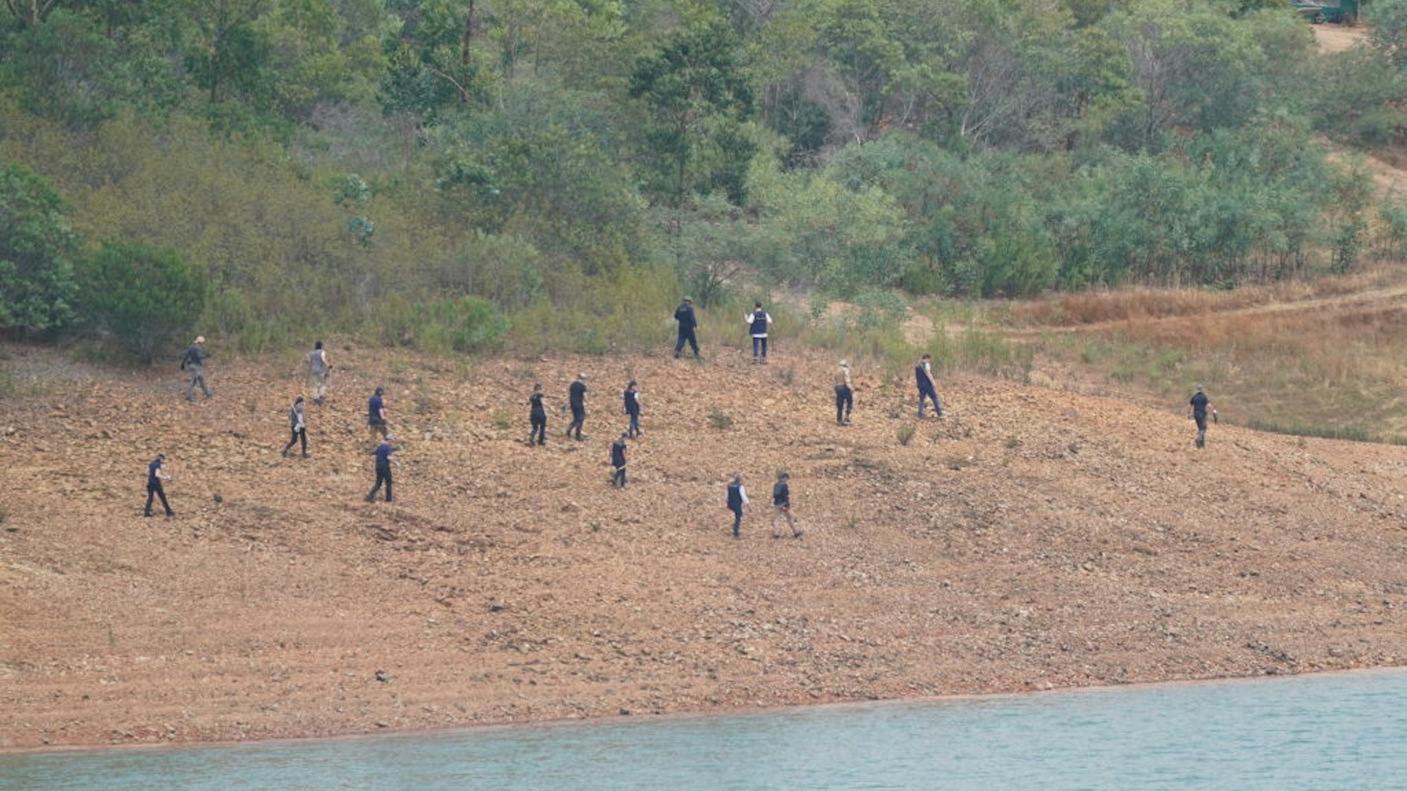 Personnel at Barragem do Arade reservoir, in the Algave, Portugal, as searches begin as part of the investigation into the disappearance of Madeleine McCann.