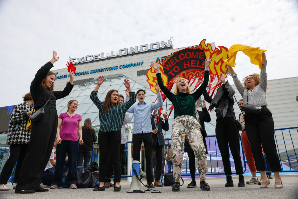 Climate activists attempt to disrupt Shell’s annual meeting with the chant “Go To Hell, Shell.”
