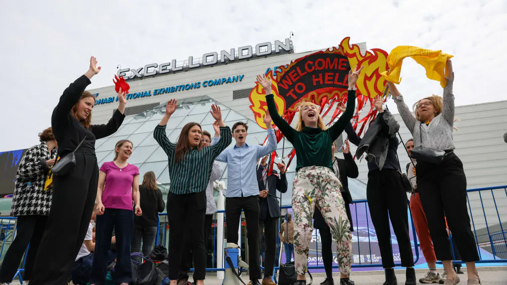 ‘Go To Hell, Shell’: Climate Activists Try To Storm Stage At Oil Giant’s Annual Meeting