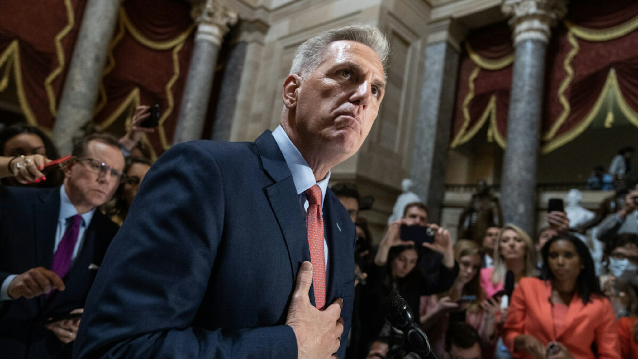 Speaker of the House Kevin McCarthy, R-Calif., talks with reporters about the debt ceiling negotiations in the U.S. Capitol's Statuary Hall on Wednesday, May 24, 2023.