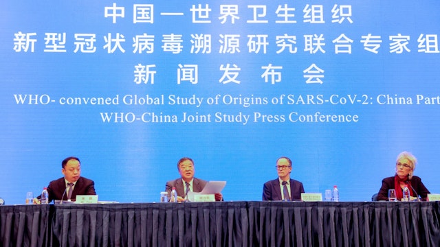 WUHAN, CHINA - FEBRUARY 09: (L-R) Experts from the WHO-China joint team Mi Feng, Liang Wannian, Peter Ben Embarek and Marion Koopmans attend the WHO-China Joint Study Press Conference on February 9, 2021 in Wuhan, Hubei Province of China.