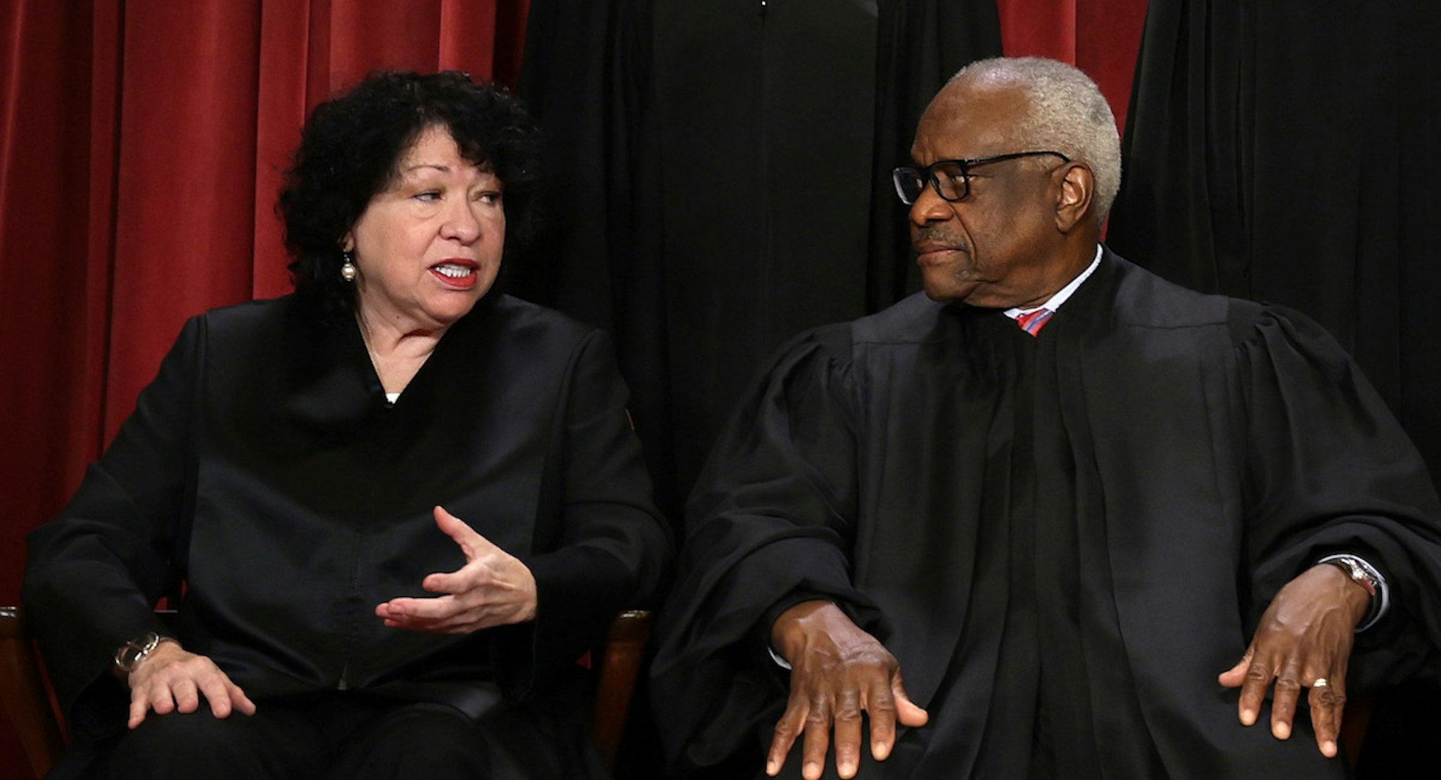 WASHINGTON, DC - OCTOBER 07: United States Supreme Court Associate Justice Sonia Sotomayor (L) and Associate Justice Clarence Thomas (R) pose for their official portrait. (Photo by Alex Wong/Getty Images)