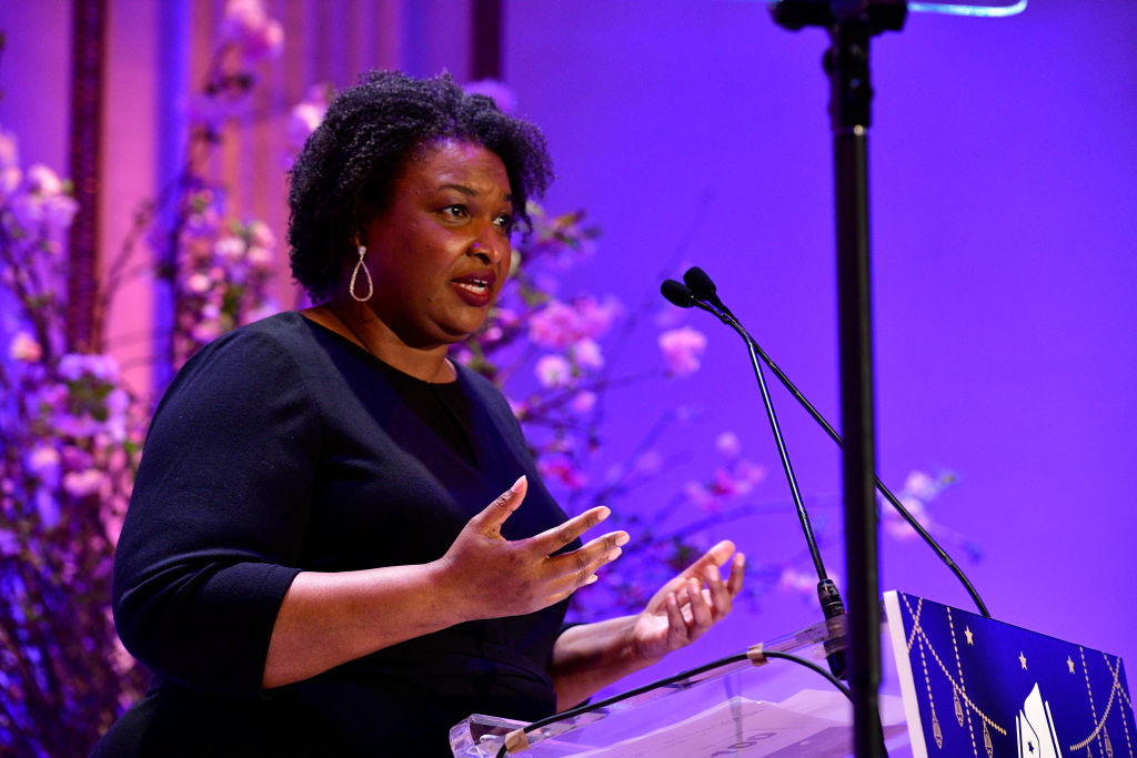 Pfizer CEO, Stacey Abrams, and other elites meet secretly in Portugal to discuss AI and Ukraine.